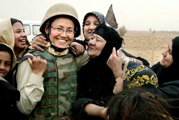 Woman Journalist hugged by Iraqi women