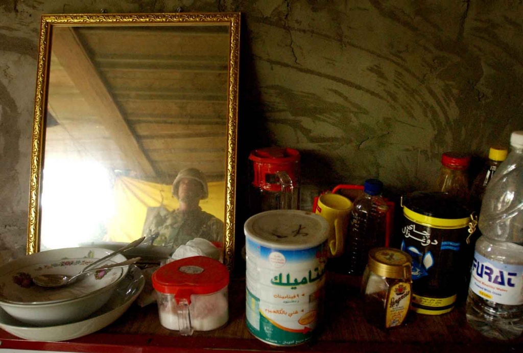 A mirror, tea, honey, sugar and bottled water were a few of the items on the counter in the farm house where Saddam Hussein was hiding out.