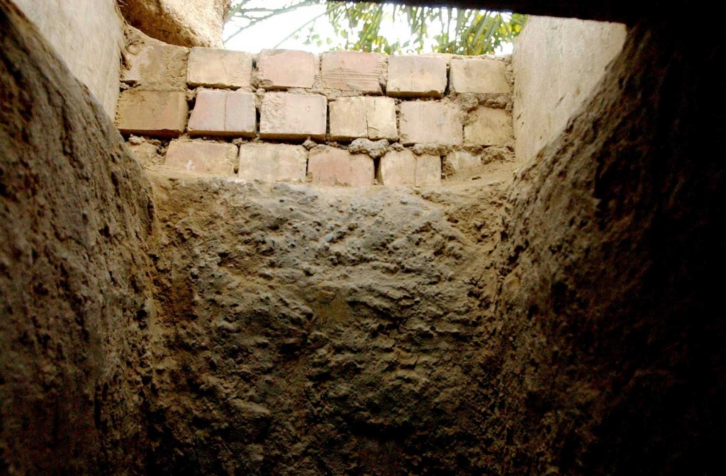 A brick-lined entrance to an underground dug out is where deposed President Saddam Hussein was found.