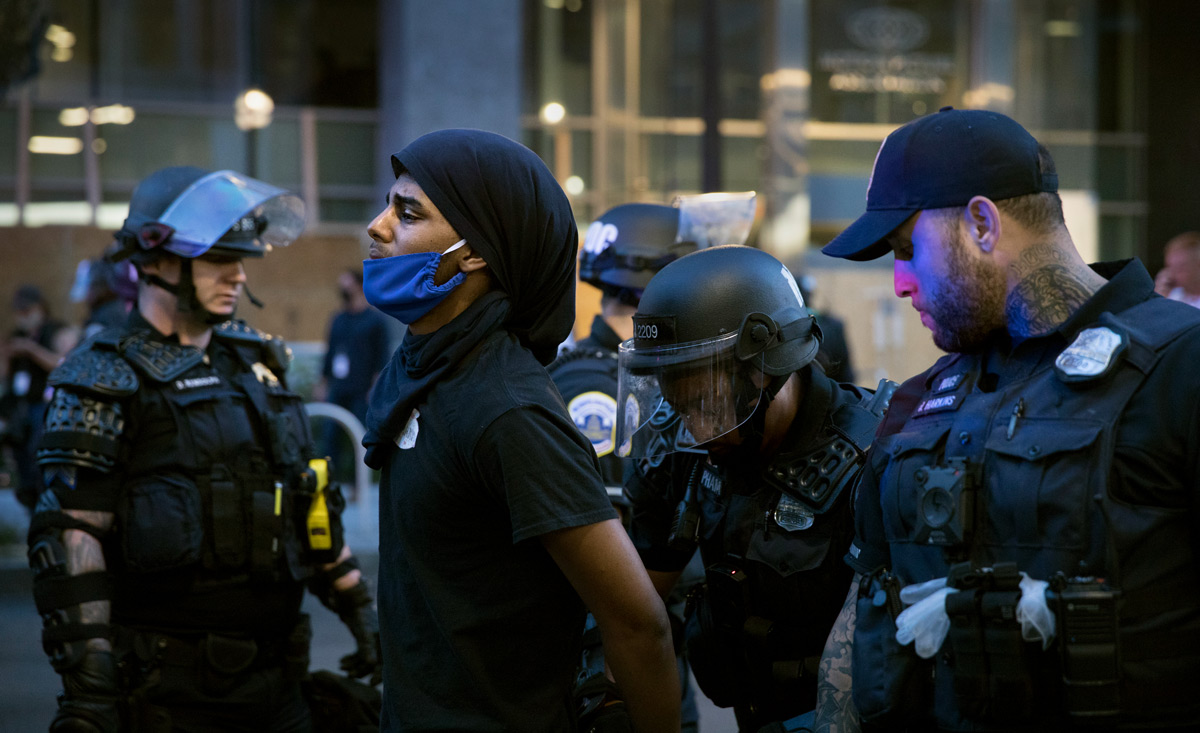 Near the White House, demonstrators peacefully protesting the death of George Floyd are encircled by the police and eventually arrested in Washington, D.C., on Monday, June 1, 2020. Floyd, a black man, died when a white police officer held his knee on the man's neck during an arrest in Minneapolis last week. The military police, National Guard and Washington police aggressively shoved demonstrators and fired stun grenades, sting balls and chemical gas to drive them away from the White House where President Trump then walked to St. John's Church for a photo op.