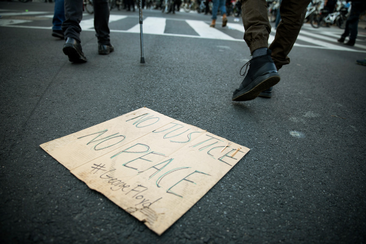 Near the White House, demonstrators peacefully protest the death of George Floyd in Washington, D.C., on Monday, June 1, 2020. Floyd, a black man, died when a white police officer held his knee on the man's neck during an arrest in Minneapolis last week. The military police, National Guard and Washington police aggressively shoved demonstrators and fired stun grenades, sting balls and chemical gas to drive them away from the White House where President Trump then walked to St. John's Church for a photo op.