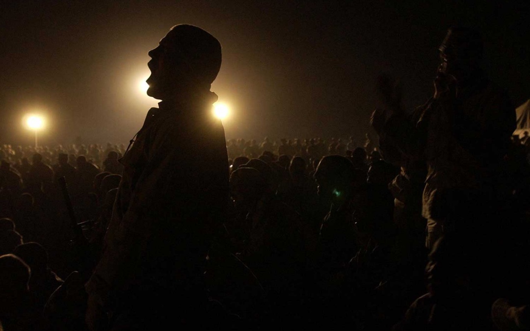 A Marine cheers at night