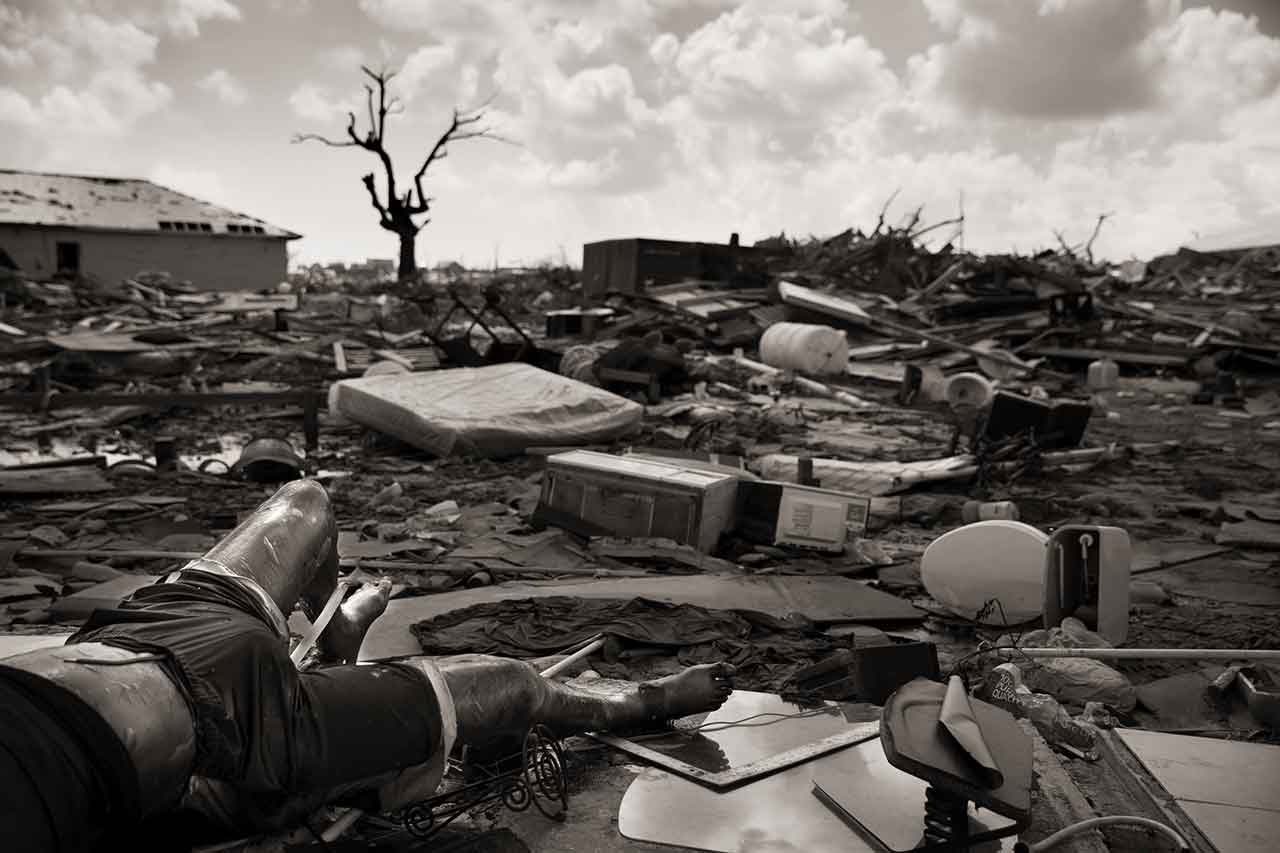 Bodies lay in the debris left by Hurricane Dorian, which decimated the town of Marsh Harbour on Abaco in the Bahamas on Sept. 6, 2019. The Mudd, an immigrant shanty town, is home to about 8,000 Haitians, some of whom have lived in the area for several generations. The number of missing has not been fully accounted as many of the Mudd's residents were undocumented Haitians, a sore point for the Bahamian government.