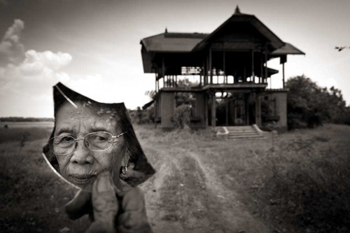 Lola Pilar Quilantang Galang, 83, survived the raid on their village of Mapaniqui in Pampanga by the Japanese Imperial Army on November 23, 1944. On that day, Galang and more than 100 other girls and women, were marched to the Bahay Na Pula, also known as the Red House, and were systematically raped by the Japanese forces as they retreated from the country at the end of World War II. Galang was 9 years old at the time of the assaults and even today can barely acknowledge the atrocities she endured. "They were just cuddling us, it wasn't consummated, just caressing because we were too young," Galang said. Yet, as she continued recounting her story, "My body bled then, and how could I have the strength? My body was a total wreck. I believe that was still rape. You can truly see that because there was blood coming from my...my body was destroyed. There was blood all over my clothes. They did it repeatedly. My body was ravaged before I was released." Galang accepted an arranged marriage, and she and husband Oscar Galang would eventually have nine children together, and now more than 40 grandchildren and great grandchildren. Through the years, Oscar Galang would remind his wife, "You are just a leftover of the Japanese." "Why would I get mad?" asked Galang. "It really happened." Pilar Quilantang Galang, 83, is reflected in a broken mirror at the site of the Red House where she and 100 other girls and women were raped by the Japanese Imperial Army during World War II.