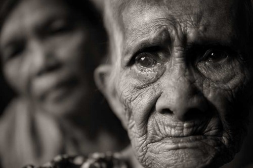 Lola Maria Quistadio Arroyo, 86, was 12 years old when she was snatched from her village and sexually enslaved for three months in Roxas City, Philippines, by the Japanese Imperial Army soldiers during World War II. Arroyo died on October 15, 2020. In a testimony taken in April 1998, Arroyo described how the Japanese soldiers were initially friendly with the villagers, but became mean after their captain was killed by a guerrilla. One day they gathered the villagers, killing anyone who protested. She saw through a window her neighbor's baby thrown in the air and impaled with a bayonet. The terrified Arroyo was then taken to the garrison with her brother, who was forced to carry the family's pig, which the Japanese had killed. Upon arrival, with no further need of him, they beat him to death. She was then locked in a room where two soldiers at a time would take turns holding her down and raping her at all hours of the day and night. She spit in their faces and fought, and in return they laughed as they kicked and slapped her. Eventually she didn't have the strength to fight them off. During the days she was made to cook and clean, and at night, she would suffer their torturous abuse. After three months, she noticed the Japanese loading hastily into their vehicles and the guards had left their posts, so she scrambled through an escape tunnel and was reunited with her parents. Arroyo met and married David Arroyo who was loving and understanding of her past. They had seven children, but he became abusive in his later years, beating her with wooden planks or his fists, and blaming her for being victimized by the Japanese until his passing in 1997. In her old age, Arroyo had dementia, was frail and cared for by her daughter Lolita Arroyo Acuyong. She suffered from a Herpes infection that destroyed most of her hearing. Photo taken on May 28, 2019. Former comfort woman Maria Quistadio Arroyo, 86, lived a tragic life starting with her abduction and sexual enslavement by the Japanese forces during World War II.