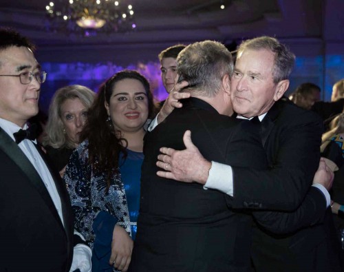 Former President George W. Bush warmly greets the former president of Poland, Alexander Kwasniewski, before accepting the 2018 Distinguished International Leadership Award from the Atlantic Council in Washington, D.C. Former President George W. Bush warmly greets the former president of Poland, Alexander Kwasniewski, before accepting the 2018 Distinguished International Leadership Award from the Atlantic Council in Washington, D.C.