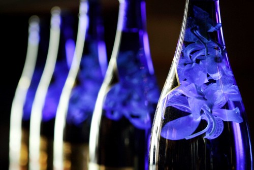 Bottles of Hokusetsu sake are filled with orchids for decoration at Nobu restaurant in the Hotel Crescent Court in Dallas, Texas. Bottles of Hokusetsu sake are filled with orchids for decoration at Nobu restaurant in the Hotel Crescent Court in Dallas, Texas.